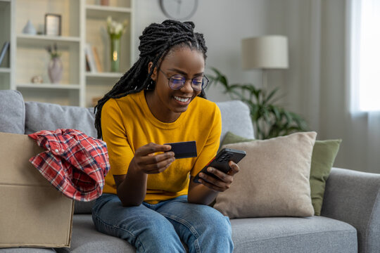 African American Young Woman Buying Something Online And Smiling