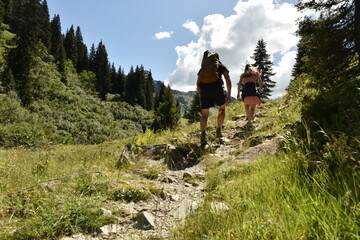 Hiking Duo Advancing on a Rocky Alpine Trail in Austria - 740933798