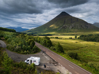 Tourists in a motorhome on the A82 road as it passes Bridge of Orchy in the Scottish highlands.