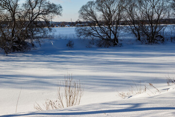 Snowy river bed in winter, clean snow cover