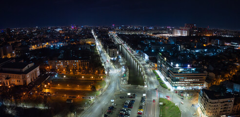 Panoramic aerial view of Bucharest city center from National Opera house and Palace of the Parliament during the night. Bucharest in the evening, view to landmarks. Travel to Romania.