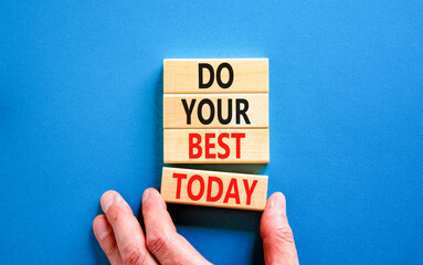 Do your best today symbol. Concept words Do your best today on beautiful wooden block. Beautiful blue table background. Businessman hand. Business motivational do your best today concept. Copy space - obrazy, fototapety, plakaty