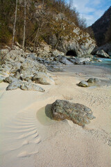 Obraz premium The Soca River near Kal-Koritnica in the Bovec municipality of the Primorska or Littoral region, north west Slovenia. This Alpine river flows from the Trenta Valley in the Julian Alps, entering Italy 