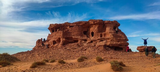 the remains of ancient castles made of stone and red clay built on a rock in the middle of the...
