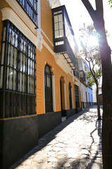 Narrow street and beautiful facades in Sanlucar de Barrameda, Cadiz