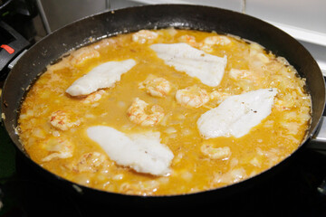 Fish in sauce with shrimp. Step by step preparation. Adding the ingredients