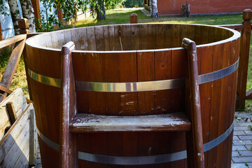 wooden baptismal with water on the street.