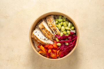 Poke bowl with chicken, peppers, edamame beans and pickled red cabbage. 