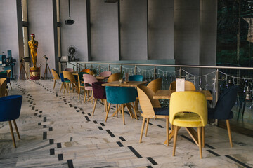 Modern cafe in loft style, black table set for coffee with brick wall. High quality photo