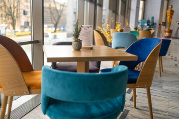Modern cafe in loft style, black table set for coffee with brick wall. High quality photo