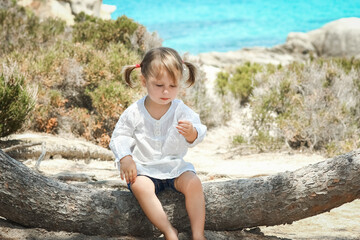 happy child playing by the sea