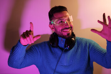 Young streamer using recreation glasses to give content to his followers. Concept: influencer.