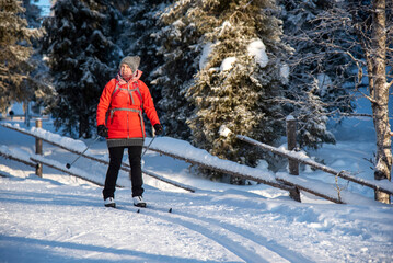 Woman cross country skiing in cold winter