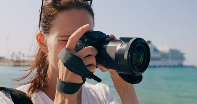 Female traveler take photo of sightseeing in sea cruise vacation. Cinematic and inspiring travel blogger live motivational adventure