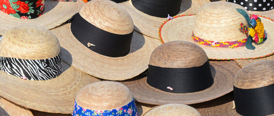 Selection of sun hats on sale in a tropical country