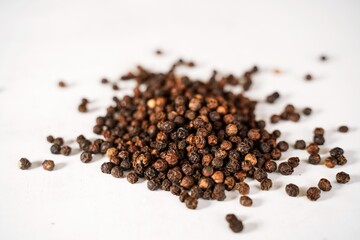 Whole black pepper | Dry peppercorn background, selective focus