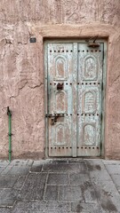 rusted antique green door