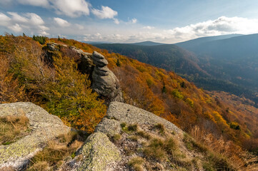Autumn panorama of mountains and forests with a view of the sunset and forests with autumn colors of trees in the Jizera mountains in the Czech Republic