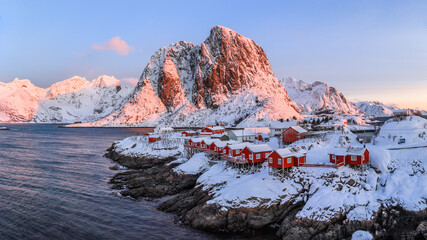 Traditional Norwegian fisherman's cabins, rorbuer, on the island of Hamnoy, Reine on the Lofoten at sunrise time Norway.