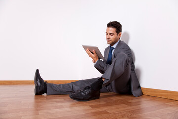 Young businessman using a digital tablet - 741016184