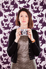 businesswoman holds a vintage camera - 741016188