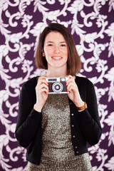 businesswoman holds a vintage camera - 741016195