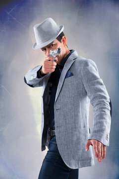 Detective holding a firegun like in the movies