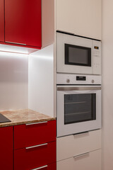 Fototapeta premium Close-Up of Modern Kitchen Appliances Integrated in Cabinetry