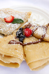 Nutella Crepes with Blueberry and Strawberry on Top Serve for Dessert, Italy