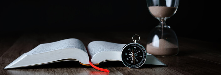 Book, compass and hourglass - obrazy, fototapety, plakaty