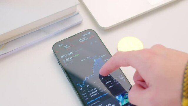 Scrolling on smart phone through Cryptocurrency stock market