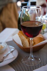A glass of red wine served on the table of a luxurious restaurant