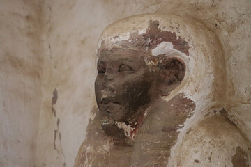 Old egyptian statue at tombs of nobles in Aswan, Egypt 