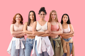 Beautiful young happy women on pink background. Women history month