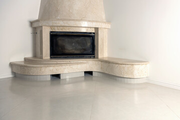 Marble fireplace. Interior of a living room with a fireplace, close-up.
