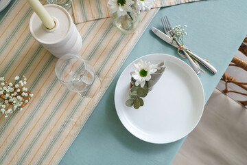 Simple table setting with silver cutlery for International Women's Day celebration
