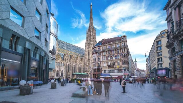 Vienna St. Stephen's Cathedral (Stephansdom) is the mother church of the Roman Catholic Archdiocese of Vienna timelapse, hyperlapse video. People walking on The Stephansplatz square, Vienna Austria