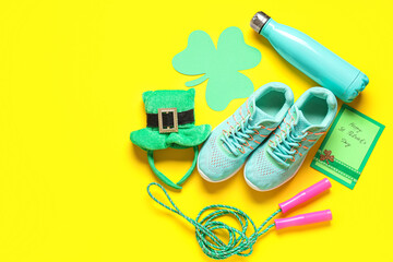 Sports equipment and decorations for St. Patrick's Day celebration on yellow background