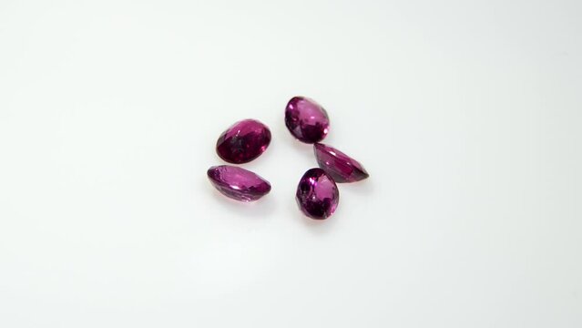 natural pink rhodolite garnet on the white background