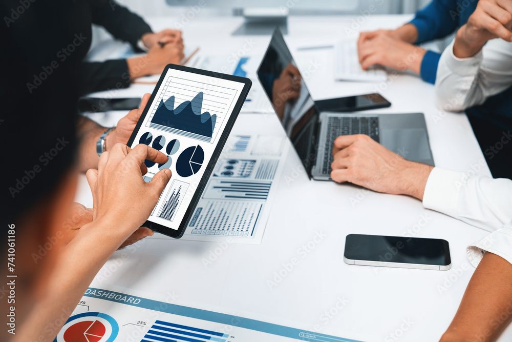 Poster Analyst team uses BI Fintech display tablet to analyze financial data . Business people analyze BI software technology dashboard power for insights power into business marketing planning. Prudent