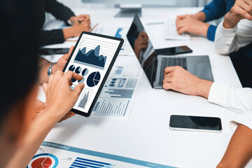 Analyst team uses BI Fintech display tablet to analyze financial data . Business people analyze BI...