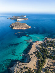Aerial view of Cala Comte beach and islets in Ibiza island