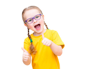 Funny girl in glasses and a yellow T-shirt shows thumbs up.