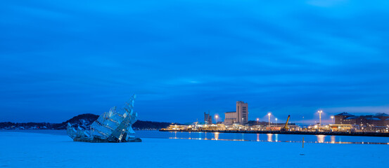Glass monument representing iceberg and fjords in front of Oslo opera house in the bay. Currently...