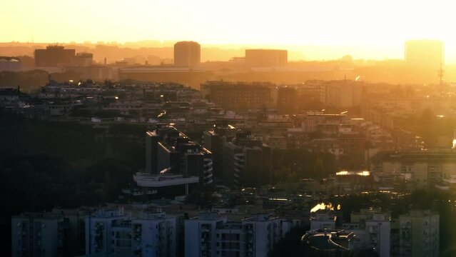 Aerial view urban sunset in Rome, Italy. Architecture of new modern housing complexes in the capital. High quality 4k footage