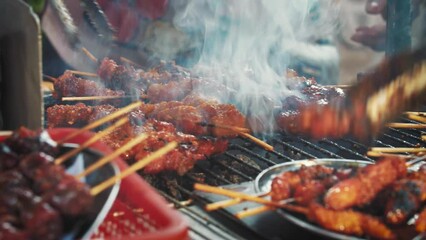 Experience Vietnam's vibrant street food scene with the iconic Banh Mi. Succulent marinated skewers grilled over street barbecue stands offer a spicy delight, making it a beloved favorite among locals