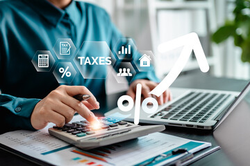 E-Filing, Taxpayer using a laptop to file taxes personal income, Tax Return form online for tax payment. Government, state taxes. Data analysis, paperwork, reports. Calculation tax return.