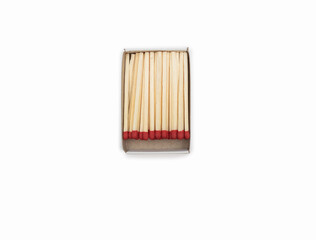 The match box and matches isolated on white background. Matches in an open matchbox on a white background. Top view of opened matchbox isolated. Close-up with a blank space for your text