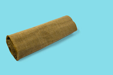 A roll of brown sack burlap isolated background.