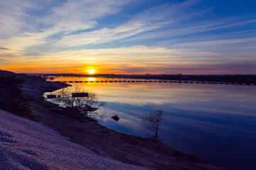 Beautiful winter sunset in the river. Riverscape sunset. Sunset at Tagus River, in the portuguese village of Chamusca